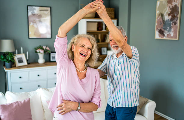 istock Happy senior couple dancing at home 2165131239