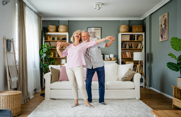 istock Happy senior couple dancing at home 2165131422