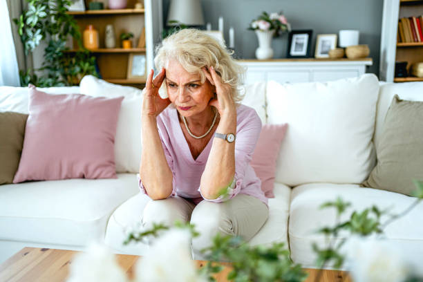 istock Senior woman suffering from headache 2165132037