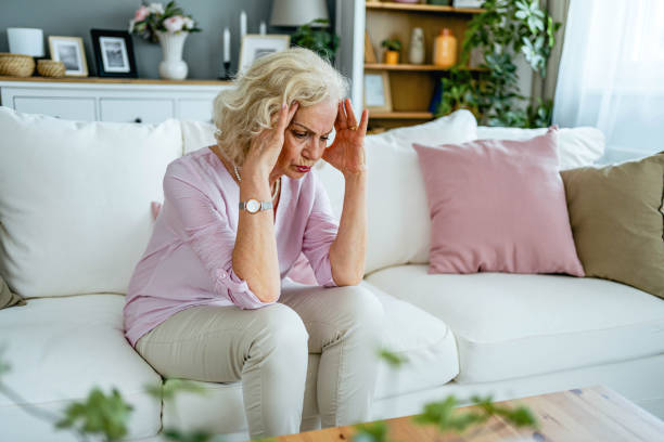 istock Senior woman suffering from headache 2165132065