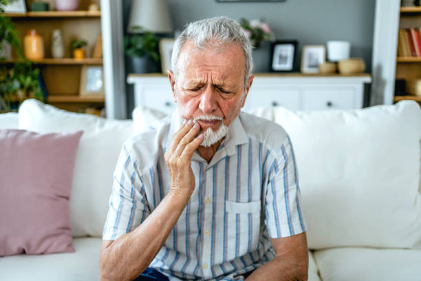 istock Senior man suffering from toothache 2165132077