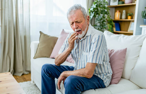 istock Senior man suffering from toothache 2165132140