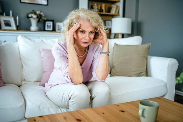 istock Senior woman suffering from headache 2165132297
