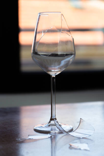 istock Broken glass of wine. Sadness after breakup 2165132380