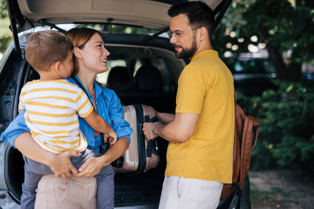 istock Parents and child organize car trunk before journey 2165133053