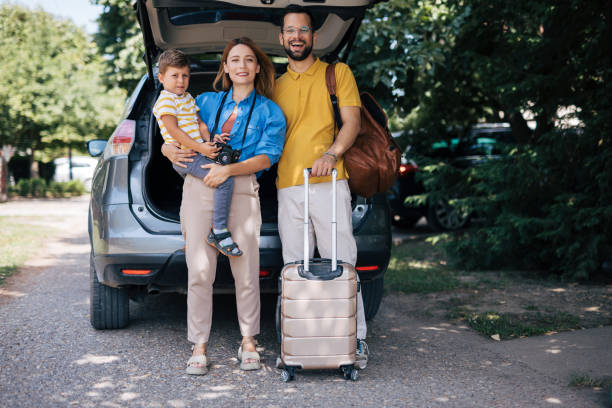 istock Family posing by car ready for their trip 2165133088