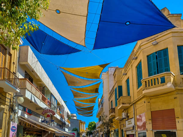 Nicosia, Cyprus - July 15th 2023: Street of Nicosia with yellow and blue sunshade structures