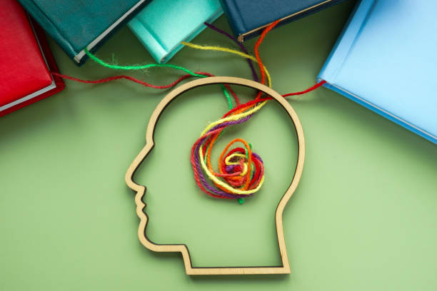 istock Upskill or lifelong learning. Head, books and threads. 2165138851