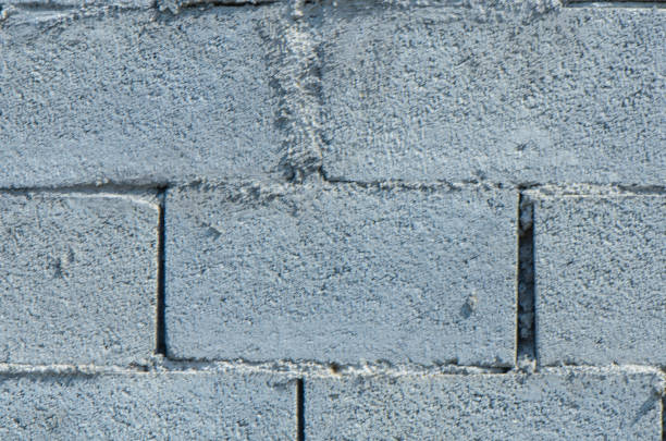 istock old gray cement background with cinder block wall 2165141065