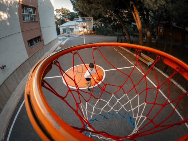 istock Young boy playing basketball in garden. 2165147939