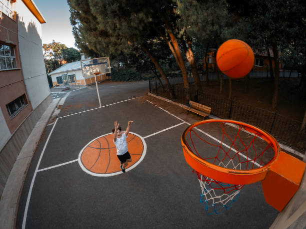 istock Young boy playing basketball in garden. 2165147943