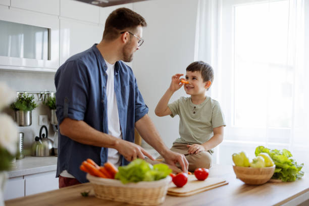 istock Father With His Son at Home Kitchen 2165149985