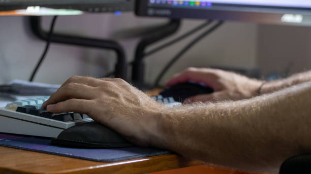 istock Playing PC video games on mouse and keyboard technology 2165152560