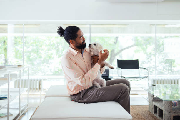 Man Relaxing at Home with His Dog in an Office