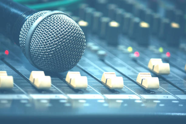 istock Microphone on stand in sound control room 2165159622
