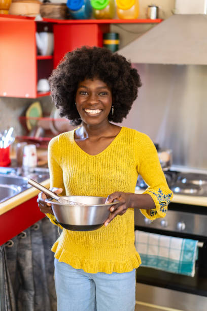 istock Woman holding a bowl in a kitchen 2165160151