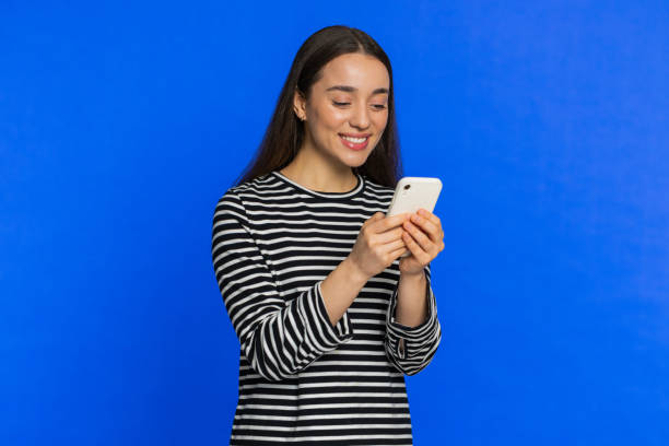 istock Woman use smartphone typing new post on web message browsing addiction of social networks play game 2165160174