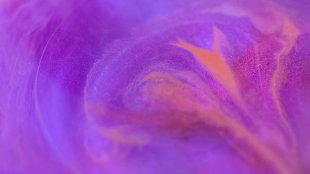 istock Paint mix shimmer ink purple magic fluid motion 2165161078