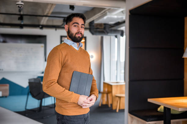 istock Confident Hispanic Businessman in Office 2165161452