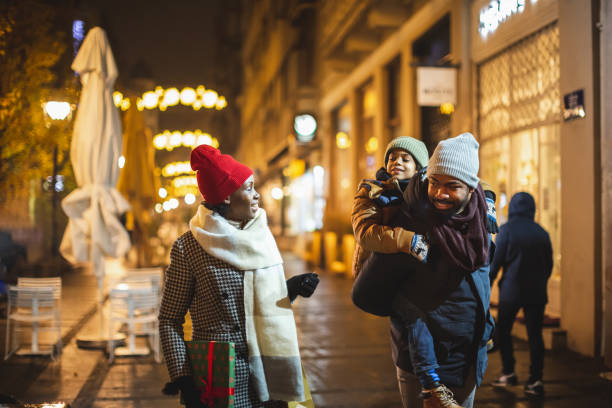 istock Happy Family Strolling at Night 2165161494