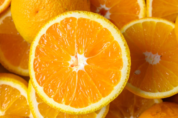 istock Sliced orange circles, laid on the surface in several layers. 2165167419