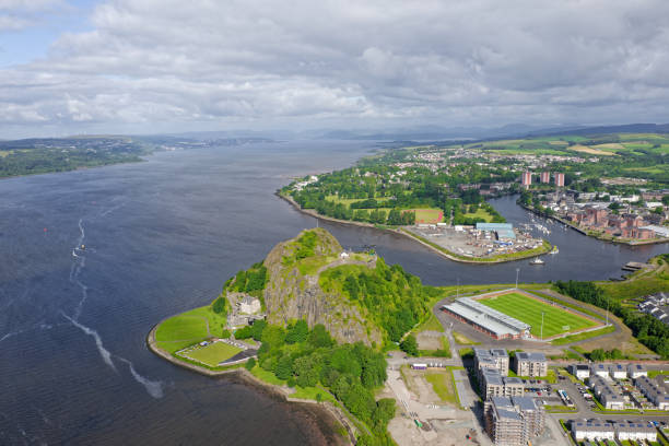 Dumbarton castle building on volcanic rock aerial view from above Scotland Dumbarton castle building on volcanic rock aerial view from above Scotland UK dumbarton castle stock pictures, royalty-free photos & images