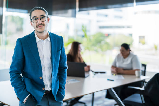 istock Successful businessman standing at corporate office. 2165172289