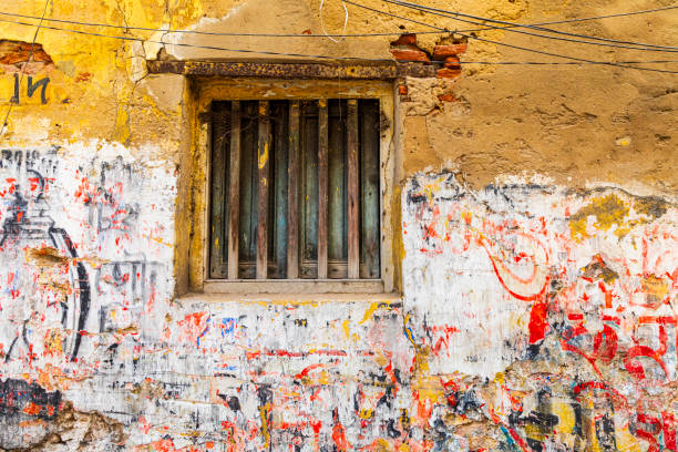 Painted over inscription. White Trail. Paint stain. Fight against graffiti. Damaged surface.
