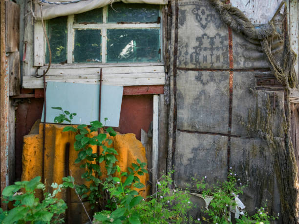 A close-up of an old, abandoned house.