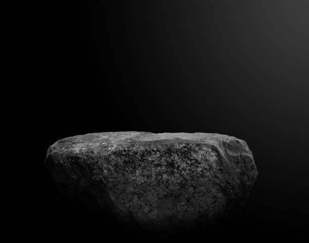 istock Stone podium on dark black background. 2165176925