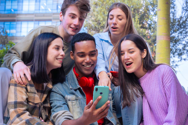 istock Students having fun with mobile phones creating content on social media. 2165187576
