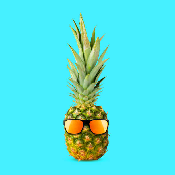 istock Cheerful pineapple in sunglasses, isolated on a blue background. Summer rest. Summer 2165187961