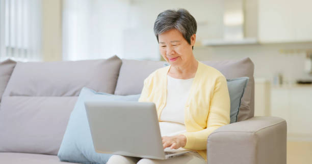 istock asian elderly female use laptop 2165190050