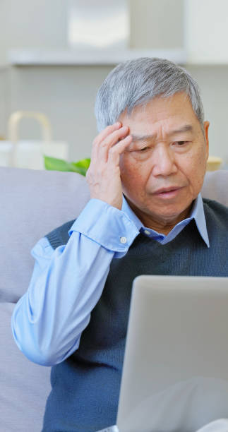 istock asian elderly laptop being scammed 2165190070