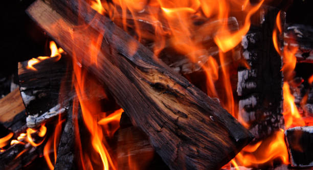 istock A large knotty log is engulfed in flames in an intensely burning fire in barbecue firebox detailed view 2165192019