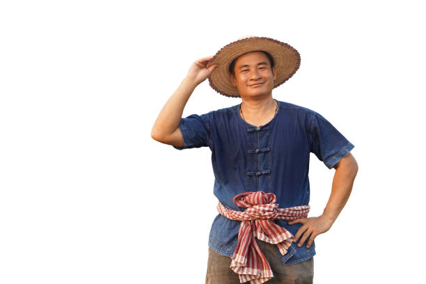 Handsome Asian man farmer  wears hat, pose hand on hip, another hand holds hat.isoleted on white background. Concept, Thai farnmer. Agricultural oocupation.