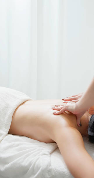 istock asian masseurs massage client back 2165195856