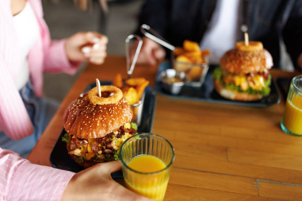 istock Young couple in burger bar 2165199657