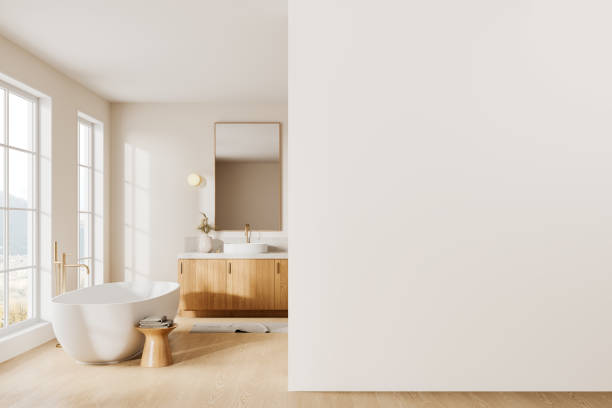 istock Elegant hotel bathroom interior with sink and bathtub, window. Mockup wall 2165201498
