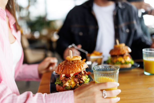 istock Young couple in burger bar 2165201683