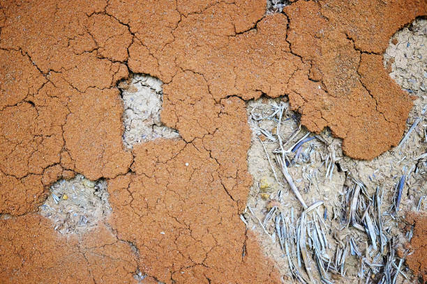 Dirty rustic and vintage orange grunge concrete wall texture and background
