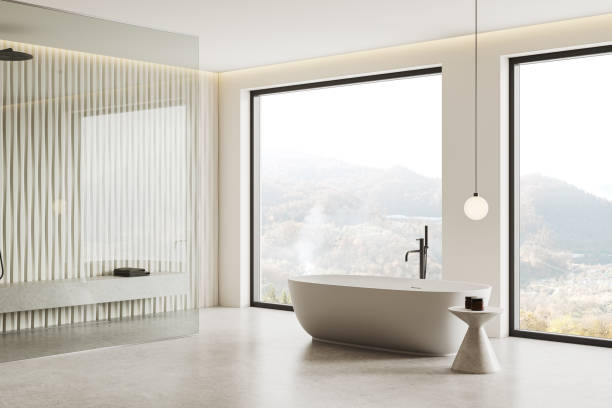 istock Light hotel bathroom interior with bathtub and glass shower, panoramic window 2165202754