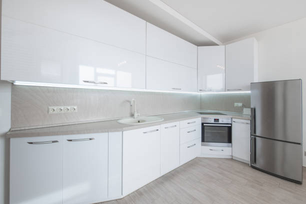 istock Scandinavian Style Cozy Modern Open Bright Minimalism Kitchen Home Interior. Oven, Faucet, Fridge. White Color 2165203807