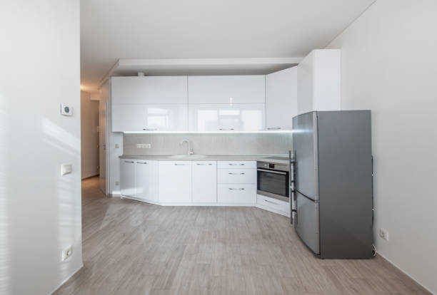 istock Scandinavian Style Cozy Modern Open Bright Minimalism Kitchen Home Interior. Oven, Faucet, Fridge. White Color 2165203837