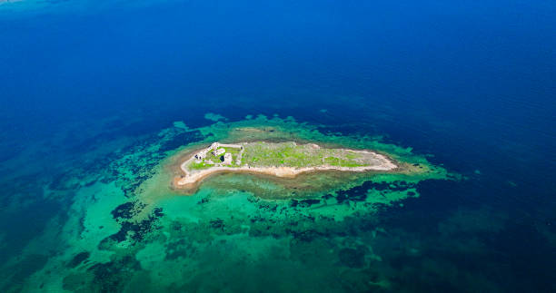 Abandoned Island in Igdeli Bay Near Cunda, Ayvalık, Exploring the Forgotten Island in Igdeli Bay, The Mysterious Abandoned Island Near Cunda, Ayvalık, Aerial Views of the Deserted Island in Igdeli Bay, Discovering the Ruins of Igdeli Bay's Abandoned
These captivating aerial photos reveal the abandoned island located in Igdeli Bay, near Cunda Island in Ayvalık, Turkey. The island features the remnants of old stone structures surrounded by the turquoise waters of the Aegean Sea. The untouched and isolated landscape highlights the island's mysterious and historical charm, making it a hidden gem in the region. abandoned island in igdeli bay near cunda, ayvalık, exploring the forgotten island in igdeli bay, the mysterious abandoned island near cunda, ayvalık, aerial views of the deserted island in igdeli bay, discovering the ruins of igdeli bay's abandoned �