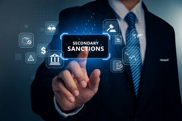 istock Hand of man pointing to SANCTIONS, Economic sanctions. 2165205273