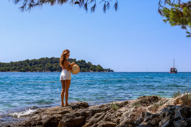 istock a girl in a bikini on an island 2 2165212897