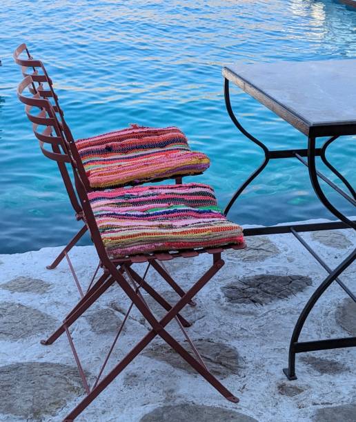 istock Striped cushions on metal chairs 2165214958
