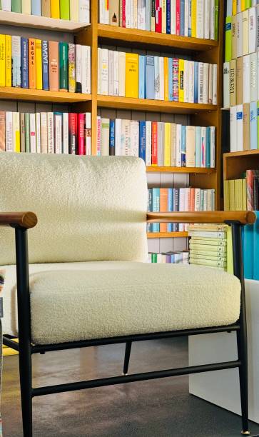 istock White Armchair in the library, low lighting 2165214998