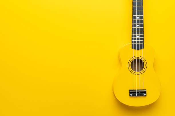 istock Flat lay photo of yellow ukulele with copy space 2165215814
